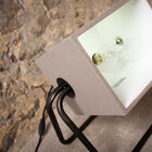 The projector is light grey in colour, like cement.