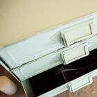 The chest of drawers has 4 drawers.