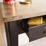 The base and drawers are made of steel and subtly varnished.