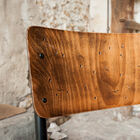 The backrest is of a nice patinated varnished wood.