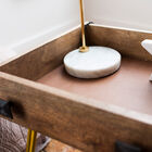 Composed of a real drawer placed on slightly flared yellow metal legs