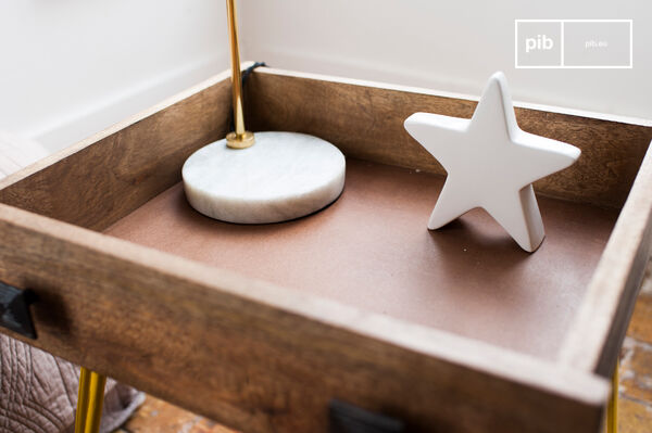 Composed of a real drawer placed on slightly flared yellow metal legs