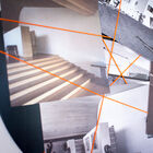 Orange threads are used to hold the photos.