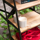 The step ladder has a pretty matt black structure.