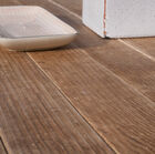 Opt for a wooden table top that has been given a lightly brushed surface filled with charm
