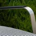 Elegant metal armrests complete the design of the chair.