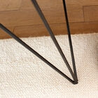 The geometric triangular base is very elegant.