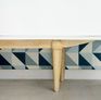 Pretty flared base in solid rubber wood.