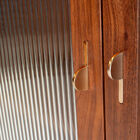 Walnut, with its chocolate and amber tones, offers an organic grain that immediately warms the room