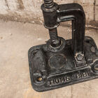 The base is matt black cast iron, factory workshop style.