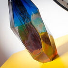 The colours of the vase range from blue, green and orange.