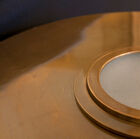 A brass table lamp with a vintage look, robust and refined