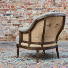 The Léonie round armchair is a beautiful armchair in grey fabric that will bring a bohemian country