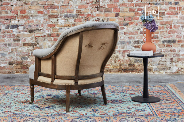 The Léonie round armchair is a beautiful armchair in grey fabric that will bring a bohemian country