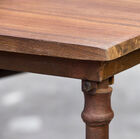 The table is mounted on a beautiful steel structure.