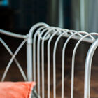 The armrests are made of rounded metal.