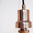 The hanging lamp Konisk combines glass and copper for a very elegant atmosphere in your interior