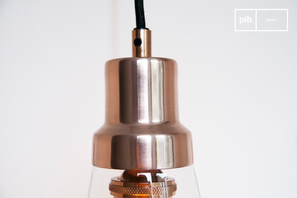 The hanging lamp Konisk combines glass and copper for a very elegant atmosphere in your interior