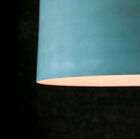 Its pale patina finish gives the lamp an airy look.