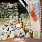 An eccentric lamp made of metal and varnished solid wood.