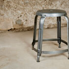 Beautiful grey stool in patinated metal.