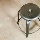 A hole in the middle of the stool serves as a handle.