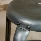 The visible rivets strengthen the industrial side.