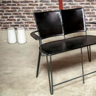 A leather bench, sober and robust