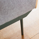 The fine matt black base lightens the visual hold of the sofa.