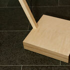 A pretty stable square base in light wood.