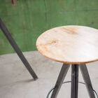 A high seat with mango wood and a metal base