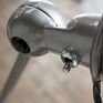 The lamp has a beautiful finish in raw metal.