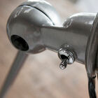 The lamp has a beautiful finish in raw metal.