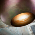 The marbled appearance of several shades and patinated black interior.