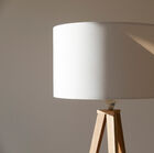 Beautiful white lampshade that blends perfectly with the wooden base.