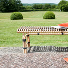 The small bench is made out of rattan material that has been assembled and braided by hand