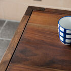 The top beautifully inlaid in the frame of the table.