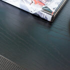 The top is made of black varnished wood.