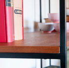 Superb contrast between the warm tones of teak and black metal.