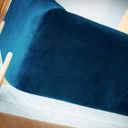 This deep blue velvet is part of the timeless vintage look of this Scandinavian sofa and is easy to