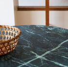 Beautiful deep green marble top with light lines.