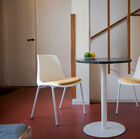 Emphasis on Simplicity through its central white metal base.