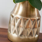 The vase displays elegant patterns in geometric relief.