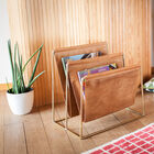 Splendid magazine holder in light leather and gilded brass.