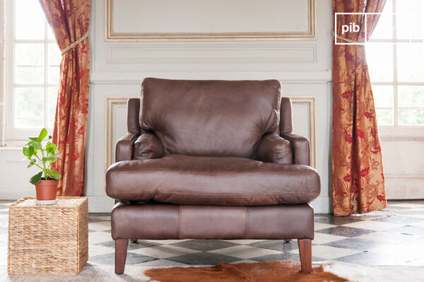 The seat is thick, deep, wide, and rests on springs and straps.