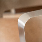 Its club design brings a touch of elegance that blends seamlessly with its camel-colored leather