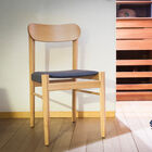Seating comfort and light wood for a chair with Nordic accents.