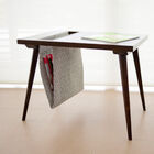 Magazine holder that can be used as a side table.