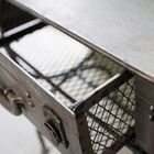 Its handle is actually that of the mesh drawer it hides in its breast.