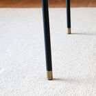 Elegant finish of the bottom of the base in gilded brass.